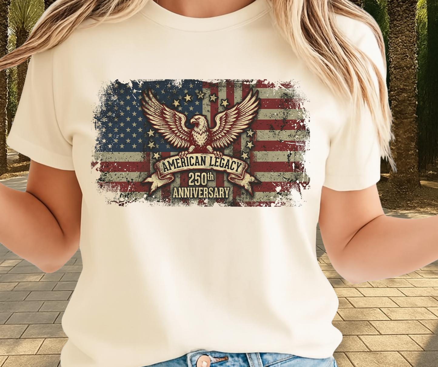 Person wearing a white t-shirt with an American flag and eagle design, text 'American Legacy 250th Anniversary'.